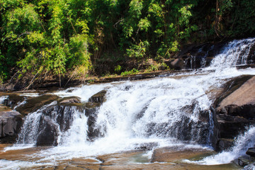Fototapeta premium Deep forest waterfall at Thaisantisuk waterfall National Park Kh
