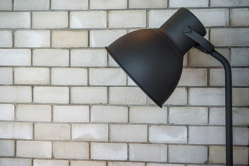 Floor lamp in brick room