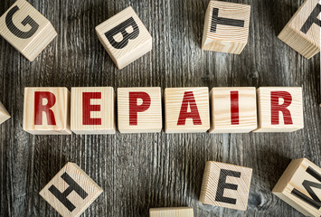 Wooden Blocks with the text: Repair