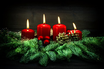 Advent decoration. Four red burning candles. Vintage style