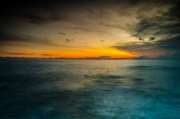 Fototapeta na wymiar beautiful nature sunset on moody sea background: soft focus