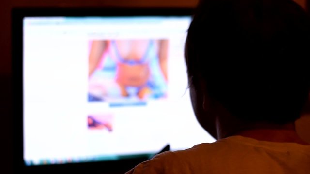 Man on Internet watching nude content, in this clips nudity are out of focus