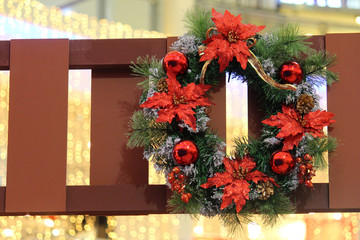 A hung up Christmas wreath decoration © t4nkyong