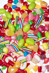 Different colored candies isolated in white background