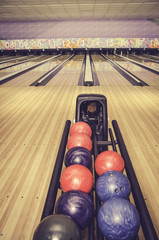 retro look red, blue and purple bowling ball. bowling lane and blur background - 95224925