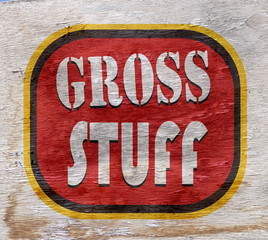 gross stuff sign on wood texture