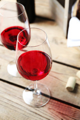 Still life of wine and bread on light background