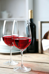 Still life of wine and bread on light background