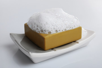 Soap with foam isolated on white