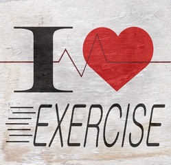 i love exercise sign on wood grain texture