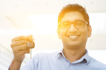 Man hand holding new car key