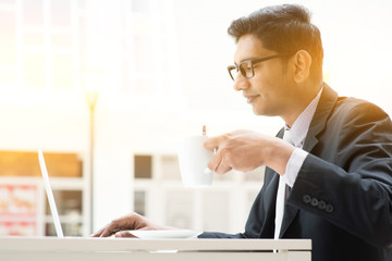 Business man using internet at cafe