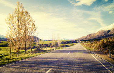 Autumn Themed Country Road With Mountain Range Concept