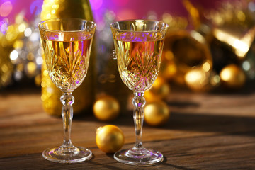 Champagne and Christmas decoration on bright background