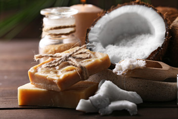Spa coconut products on dark wooden background