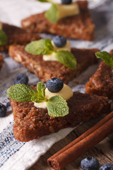 cinnamon toast with blueberries and butter macro. vertical
