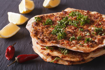 Lahmacun - Turkish pizza closeup on a table. horizontal
