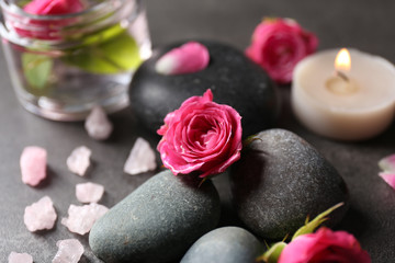 Obraz na płótnie Canvas Spa composition of stones and flowers, close-up