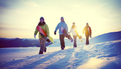 Group of Snowboarders on Top of the Mountain Concept