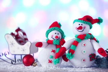 Cute snowmen on Christmas background