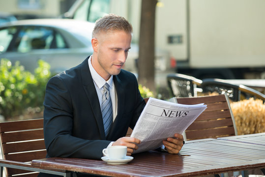 Businessman Reading Newspaper