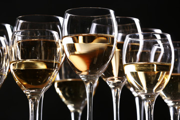 Half full wine glasses on a table