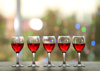 Wine glasses with wine on a table outside