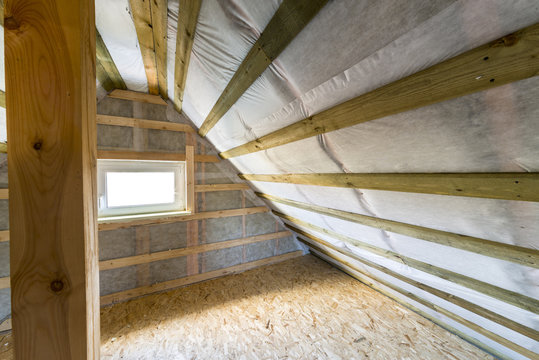 Attic with vapor barrier and window