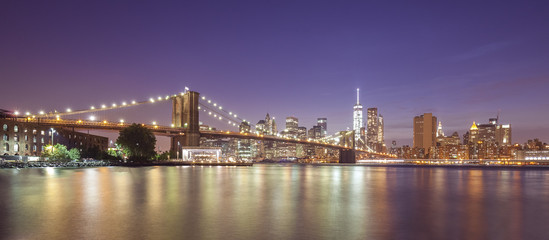 Obraz na płótnie Canvas Brooklyn Bridge and Manhattan waterfront at night, NYC, USA.