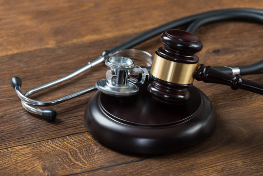 Gavel And Stethoscope On Table