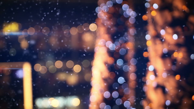 defocused christmas lights in wintry city
