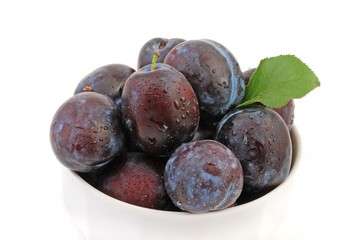 Fresh plums isolated on white background. 