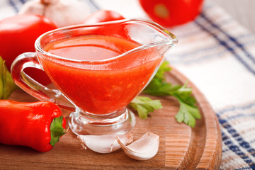 Tomato sauce in a glass gravy boat