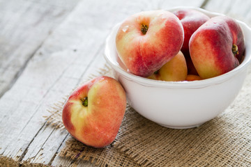 Peaches in white bowl