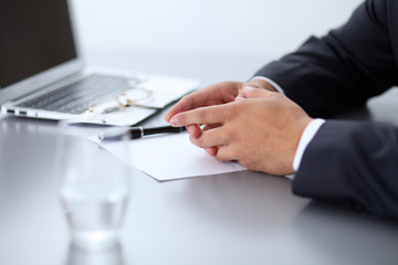 Close-up of male hands with pen over document,  business concept