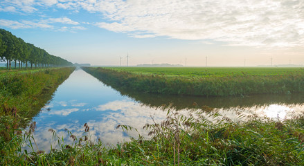 Canal through a rural landscape in autumn
