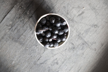 Black berries in a paper cup