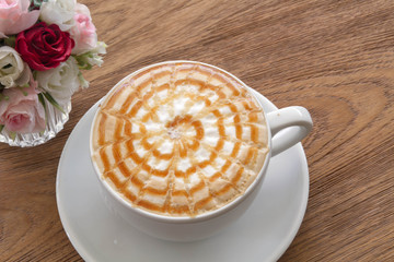 A cup of Coffee, latte on the wooden table