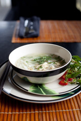 Traditional Vietnamese beef soup pho . Wooden background