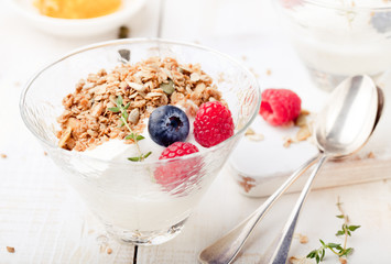 Healthy breakfast. Granola with pumpkin seeds, honey, yogurt, fresh berries .