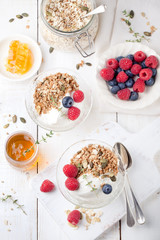 Healthy breakfast. Granola with pumpkin seeds, honey, yogurt, fresh berries .