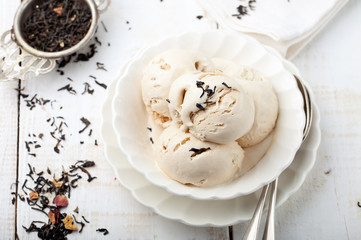 Ice cream with Earl grey tea flavor. White ceramic bowl 
