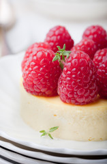 Cheesecake with fresh raspberries on a white plate. Dessert.