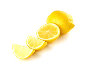 Quarter, half and full lemons isolated on white
