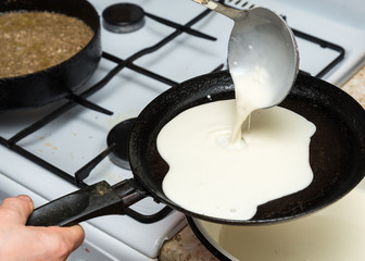 Pancakes cooking on hot skillet