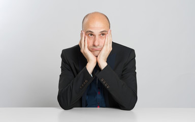thoughtful bald businessman