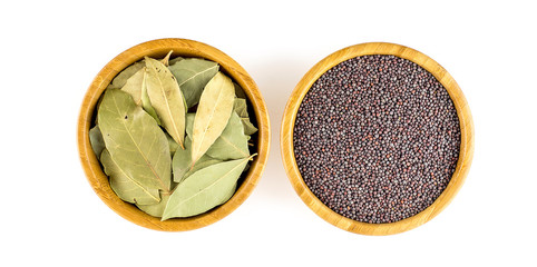 Wooden bowls of bay laurel and dark mustard