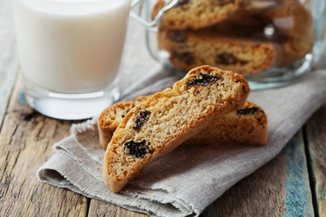 Biscotti or cantucci with raisins on wooden rustic table, traditional Italian biscuit or cookie