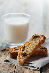 Biscotti or cantucci with raisins on wooden rustic table, traditional Italian biscuit or cookie