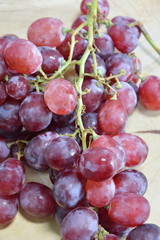 grape on wooden chop plate
